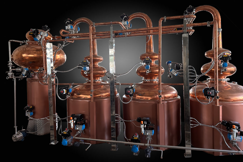 three huge red copper pot stills and one red copper heat exchanger are connected with red copper pipelines