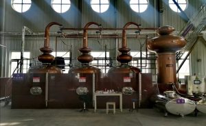the triple pot still continuous distiller working at site, each pot still is heat isolated with built blocks